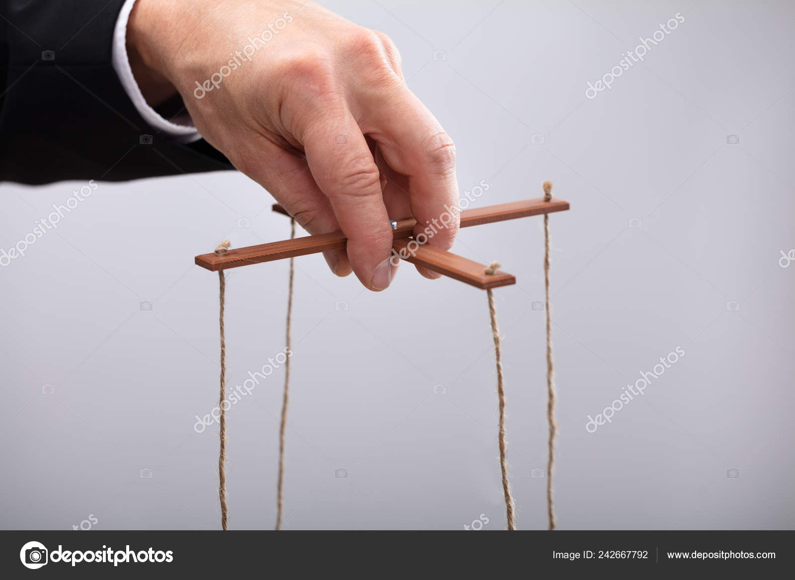 Close Businessperson s Hand Manipulating Marionette String Stock