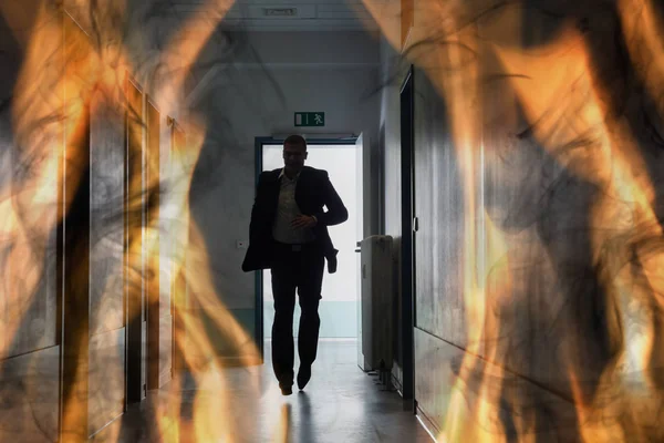 Silhuett Person Running Out Fire Escape Corridor Building — Stockfoto