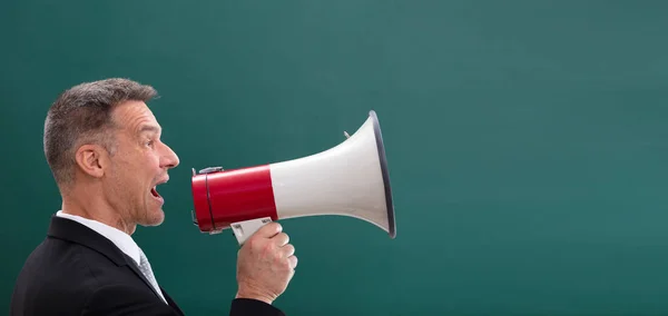 Happy Mature Man Doing Announcement Using Megaphone Front Chalkboard — Stock Photo, Image