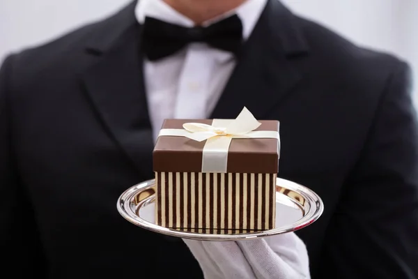 Close Male Waiter Wearing Bow Tie Presenting Small Gift Box — Stock Photo, Image