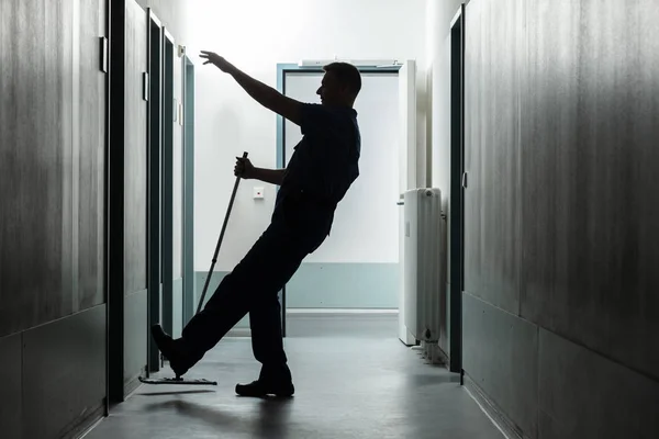 Silhouette Mature Man Falling While Mopping Floor Corridor — Stock Photo, Image