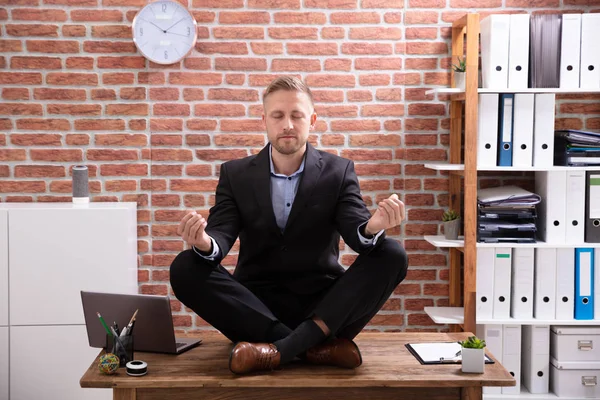 Young Businessman Sitting Desk Meditating Office — Stock Photo, Image