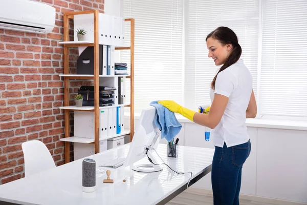 Smiling Young Female Janitor Cleaning Computer Napkin Office — Stock Photo, Image