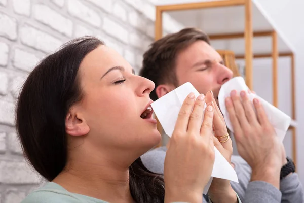 Close Sick Couple Sneezing Tissue Home — Stock Photo, Image
