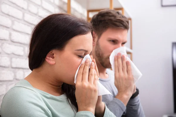Close Sick Couple Sneezing Tissue Home — Stock Photo, Image