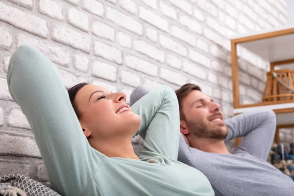 Happy Young Couple Relaxing Sofa Home — Stock Photo, Image