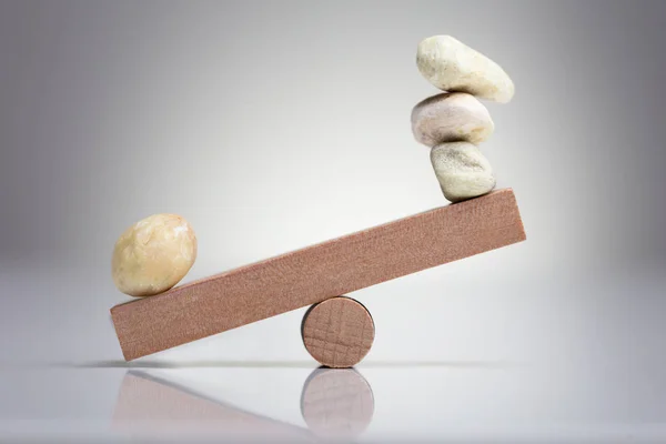 Pebble Stones Balancing Wooden Seesaw White Background — Stock Photo, Image