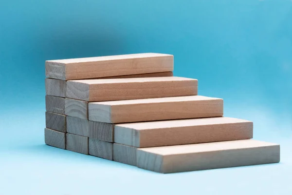 Close Wooden Building Block Stacked Blue Backdrop — Stock Photo, Image