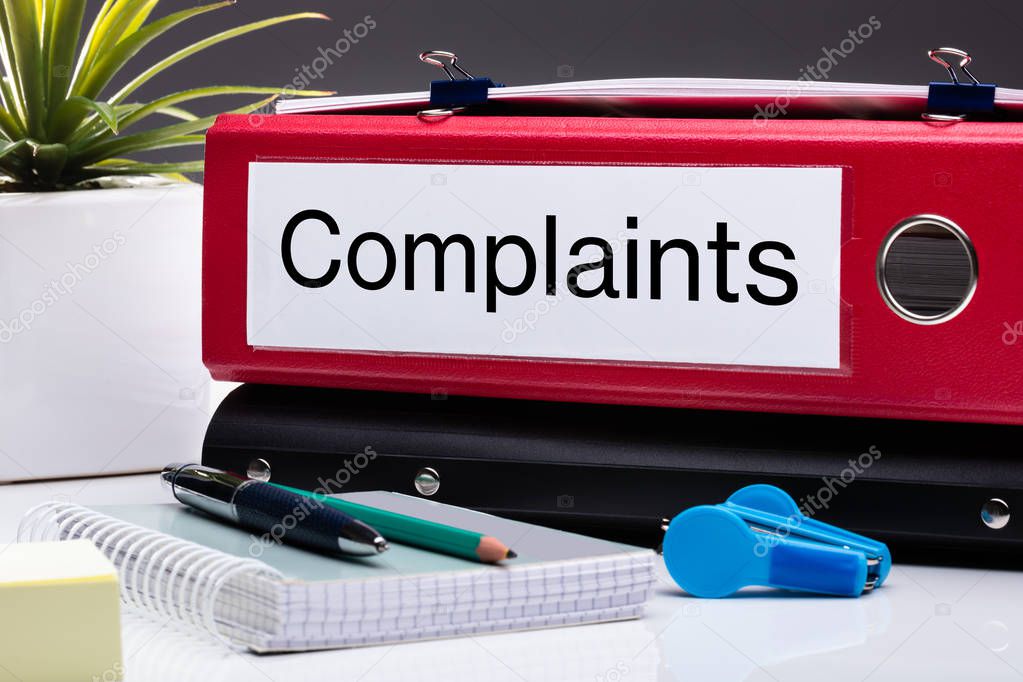 Close Up Of Compliance Folder And Office Supplies On Office Desk