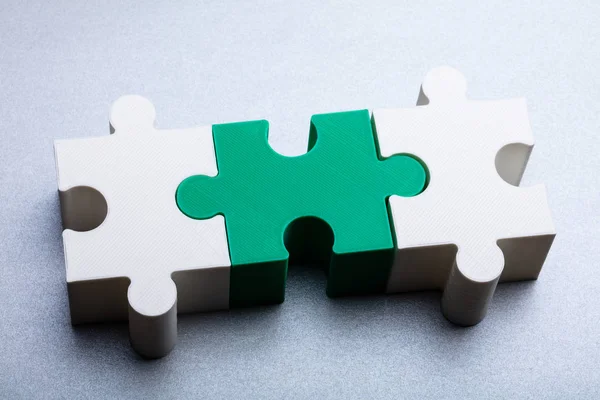 Close White Green Jigsaw Puzzle Block White Textured Background — Stock Photo, Image