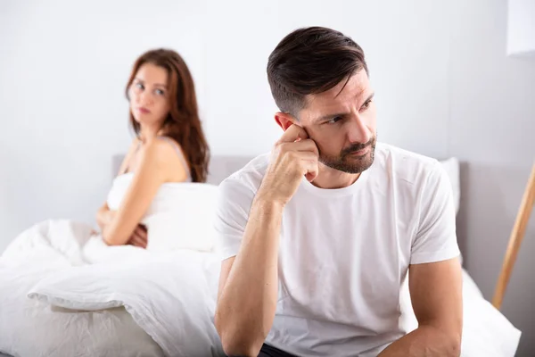 Close Depressed Man Sitting Bed Front Her Wife — Stock Photo, Image