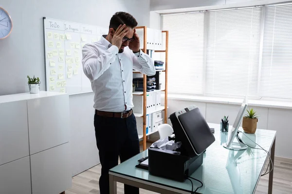 Young Irritated Businessman Looking Printer Office — Stock Photo, Image