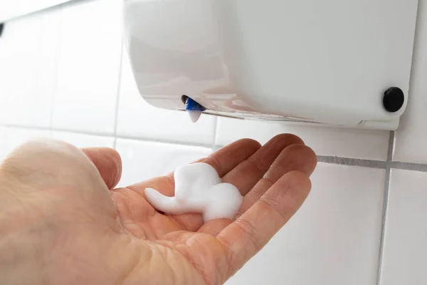 Close Person Hand Liquid Soap Dispenser Tiled Wall — Stock Photo, Image