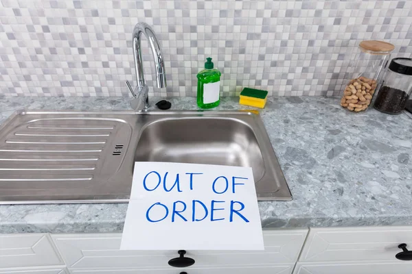 Written Text Out Of Order Message On Paper Over The Stuck Kitchen Sink