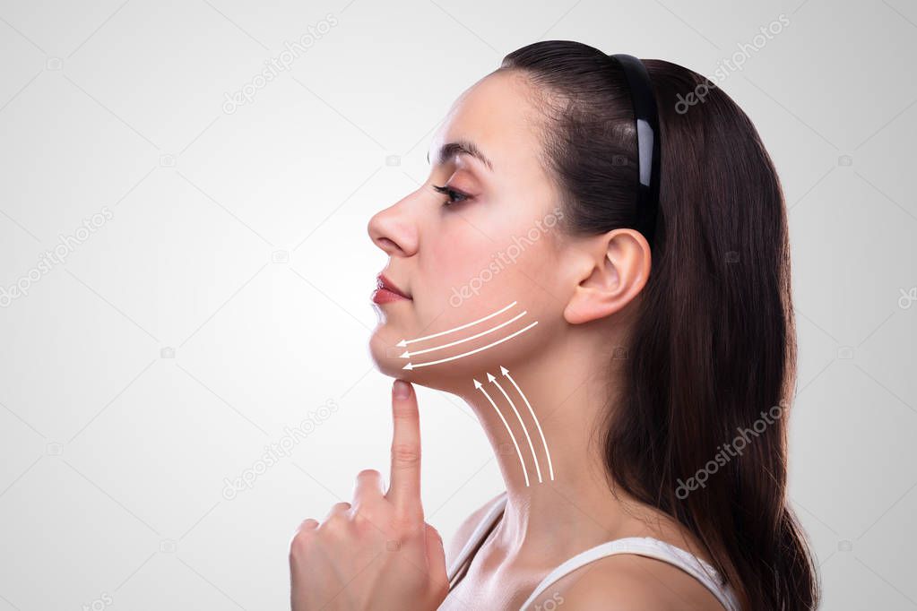 Woman With Arrows On Her Face Over White Background