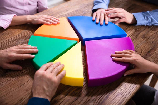 Businesspeers Connecting Pieces Multi Colored Pie Chart Wooden Desk — 스톡 사진