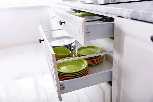 Set Different Clean Plates Opened Drawers Kitchen — Stock Photo, Image