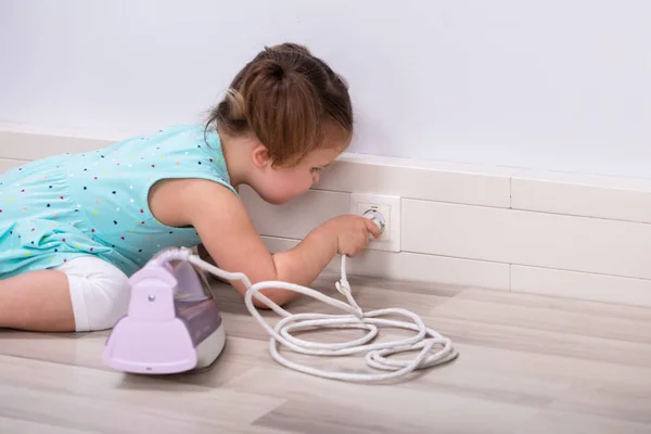 Toddler Trying Insert Iron Wire Electric Plug Home — Stock Photo, Image