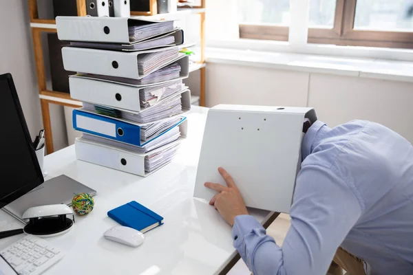 Stressed Businessman Hiding Folder While Working Desk — Stock Photo, Image