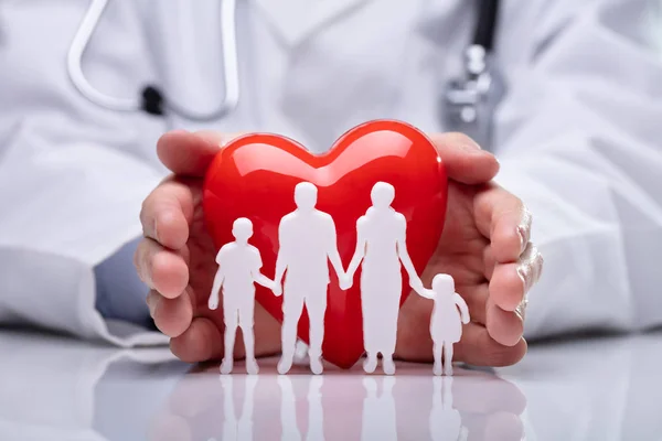 Close Doctor Hand Protecting White Family Paper Cut Out Heart — Stock Photo, Image