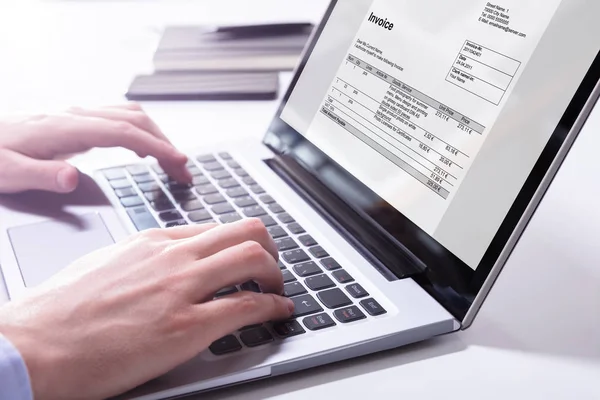 Close Businessman Hand Checking Invoice Laptop — Stok Foto