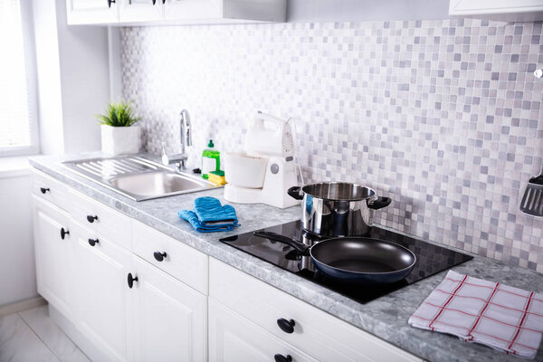 View Of A Modern Kitchen Worktop With Utensils And Induction Stove