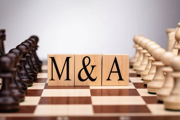 Chessboard Wooden Blocks Showing Mergers Acquisitions Concept — Stock Photo, Image