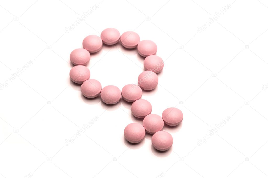Woman Gender Symbol Made From Pink Round Pills On White Background