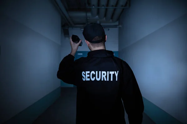 Rear View Male Security Guard Flashlight Standing Corridor — Stock Photo, Image