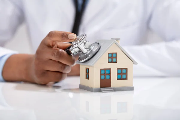 Close Doctor Hand Checking Simple Model House Stethoscope — Stock Photo, Image