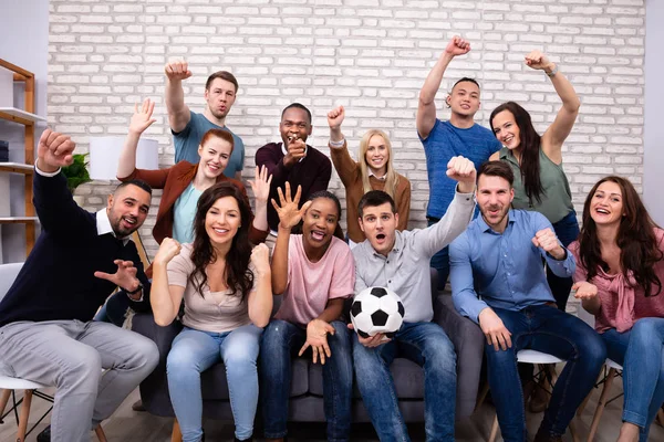Excited Multiracial Friends Sitting Sofa Watching Soccer Match Home — Stock Photo, Image