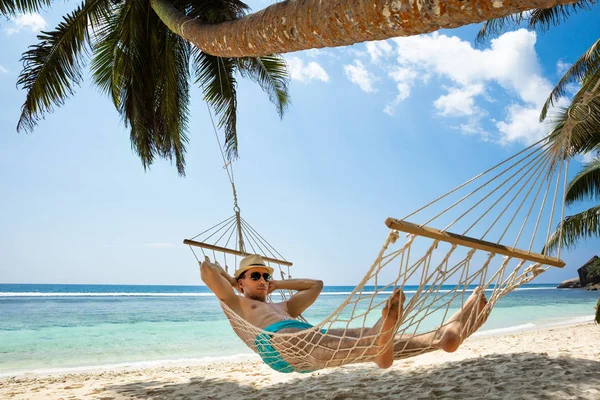 Close Young Man Relaxing Hammock Tied Palm Tree Beach — Stock Photo, Image