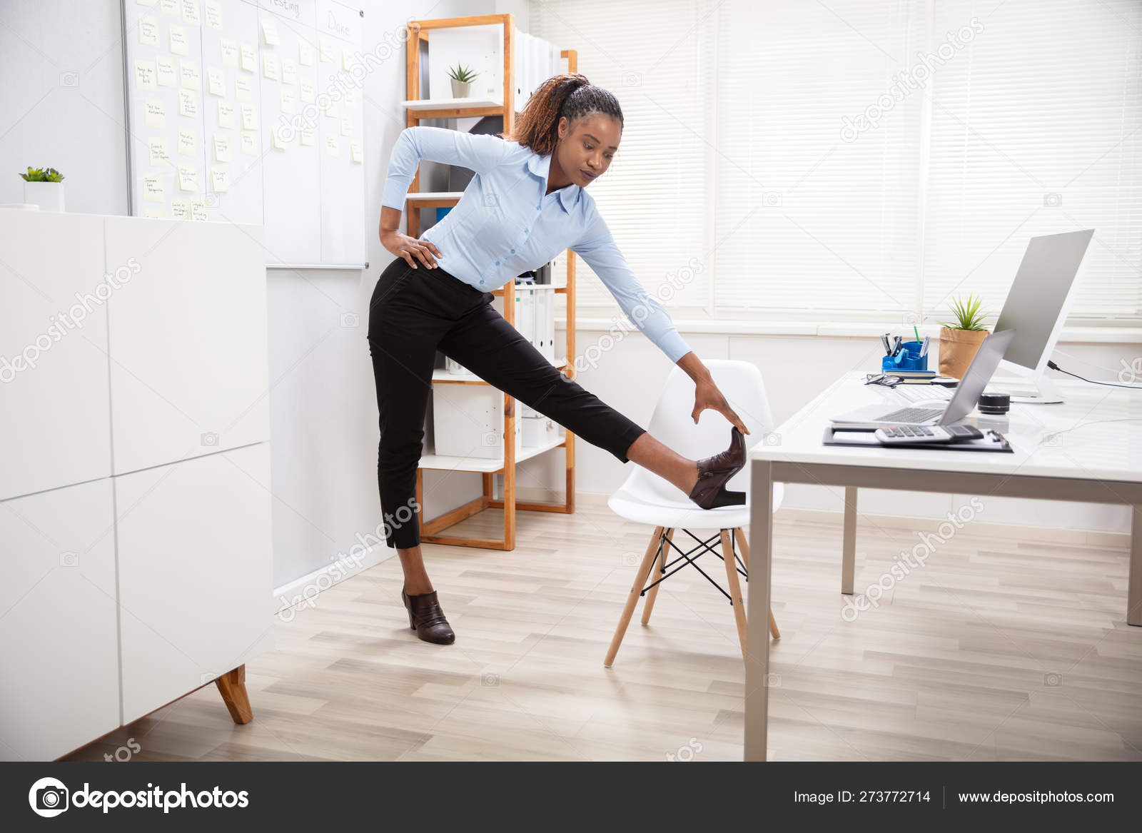 Young Businesswoman Doing Yoga Standing Front Office Desk Stock