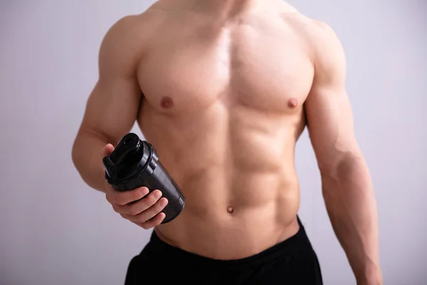 Shirtless Fitness Man Holding Protein Shaker Bottle Gray Background — Stock Photo, Image