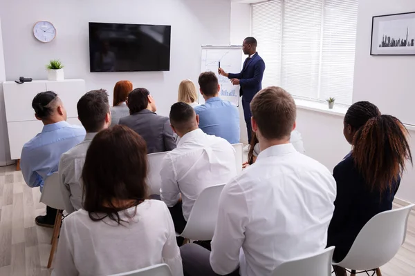 Portrait Handsome Young Businessman Giving Presentation His Colleagues Sitting Chair — Stock Photo, Image