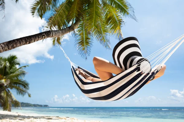 Close Woman Relaxing Striped Hammock Tied Palm Tree Idyllic Beach — Stock Photo, Image