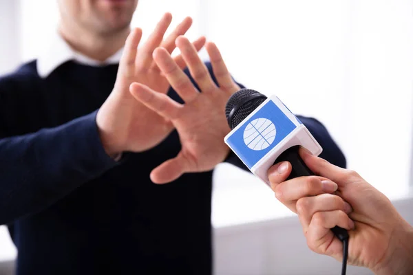 Close Female Reporter Hand Holding Microphone While Man Refusing Interview — Stock Photo, Image