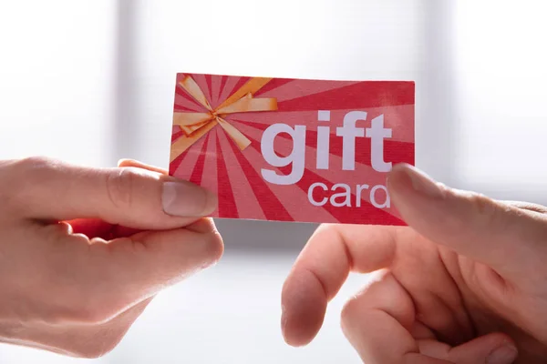 Close Female Hand Giving Gift Card Her Male Partner — Stock Photo, Image