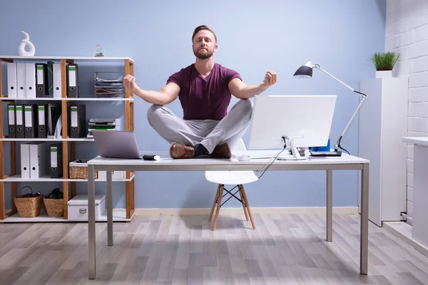 Young Businessman Sitting Desk Meditating Office — Stock Photo, Image