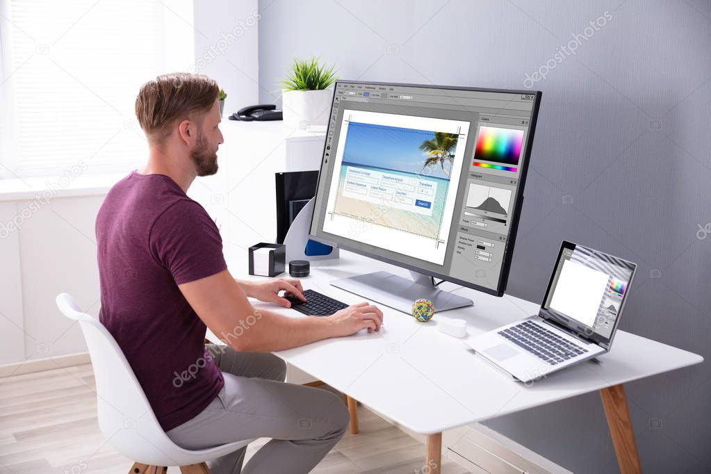 Designer Editing Photo On Computer In Office