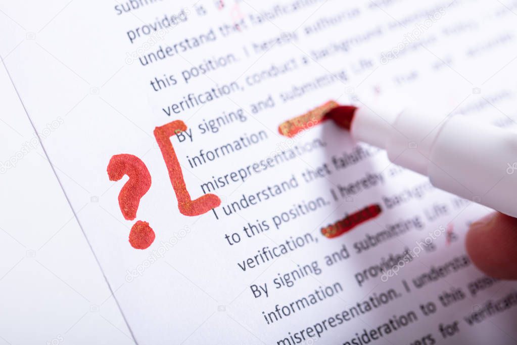 Human Hand Holding Red Marker During Spellchecking Text With Question Mark Sign