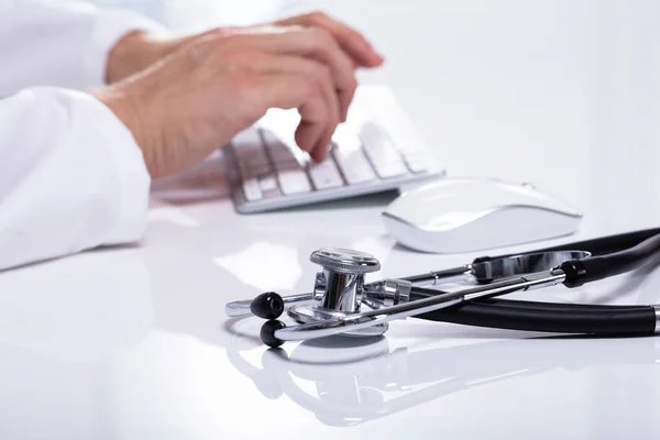 Close Stethoscope White Desk Doctor Typing Wireless Keyboard — Stock Photo, Image