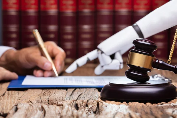 Robotic Hand Assisting Person Signing Document Reflective Desk Courtroom — Stock Photo, Image