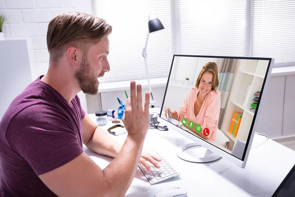 Close-up Of Male Coach Video Conference On Computer With Client