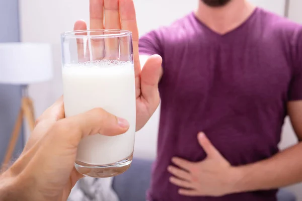 Close Man Rejecting Glass Milk Offered Person Home — Stock Photo, Image