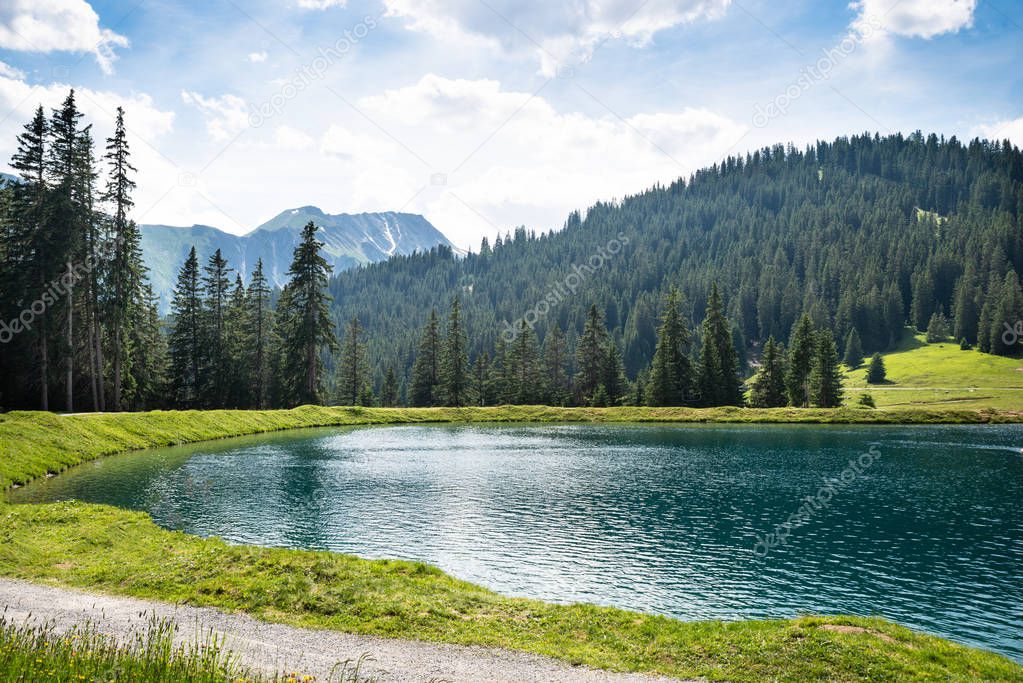 Scenic View Of Lake In Mountains. Austria, Alps