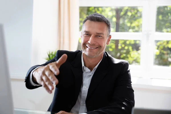 Portrait Confident Businessman Offering Handshake Office Stock Photo