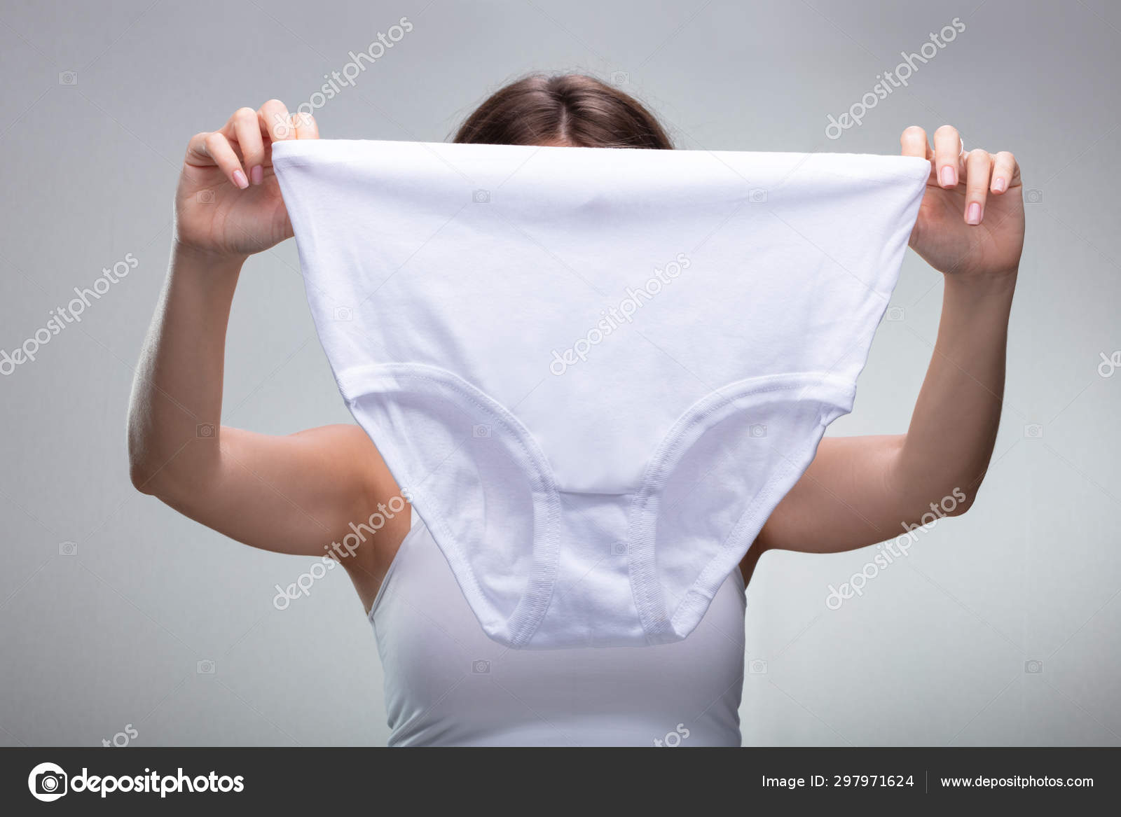 Close Woman Holding White Underwear Stock Photo by ©AndreyPopov