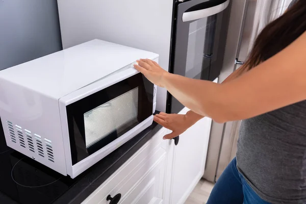 Close Woman Pressing Button Microwave Oven — Stock Photo, Image