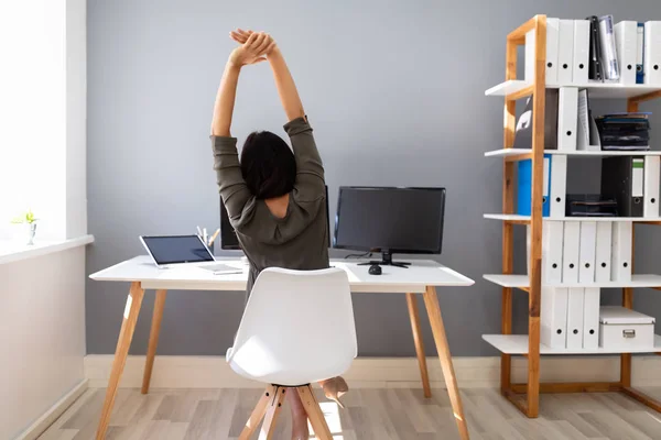 Rear View Young Businesswoman Stretching Her Arms Office — Stock Photo, Image